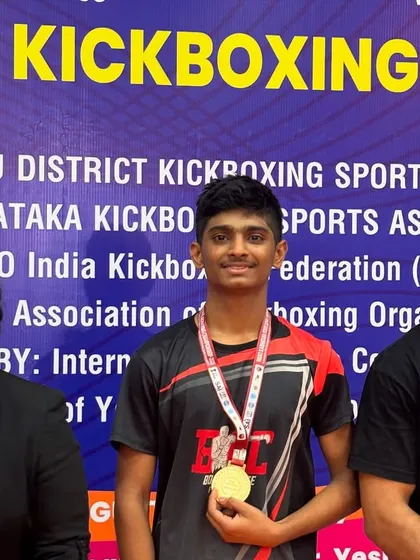 Posing with a new gold medalist. The hard work in the gym shows itself under the competition lights.