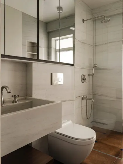 A bathroom in Apartment 1005 featuring a custom marble sink and clean, modern fixtures. The design prioritizes functionality without sacrificing beauty, showcasing how we approach even the most utilitarian spaces with a designer's eye.