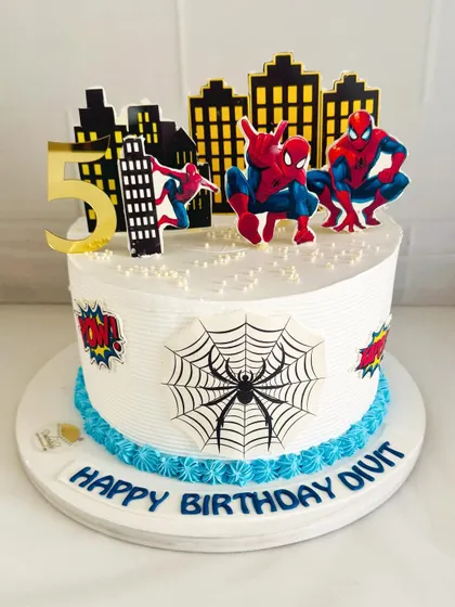 This Spider-Man cake features a city skyline backdrop, making it feel like he's swinging right through the city.