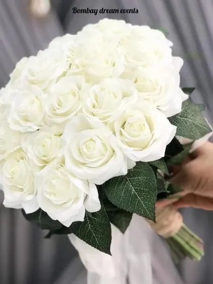 An elegant and timeless bouquet of pure white roses. This classic arrangement is perfect for weddings, anniversaries, or any occasion that calls for a touch of sophistication.