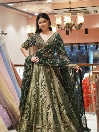 Embrace the festive spirit with this brocade green lehenga. The rich texture and vibrant hue make it an ideal choice for any celebration.