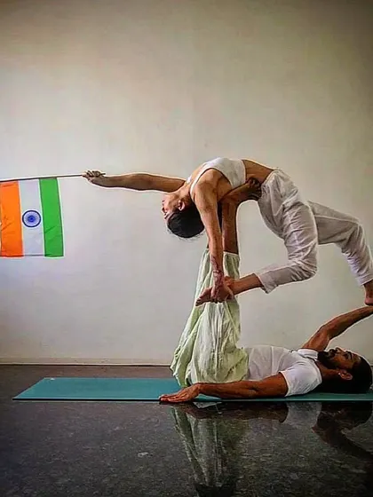 Another view of our Independence Day acro yoga practice. It is a symbol of lifting each other up and finding harmony together.