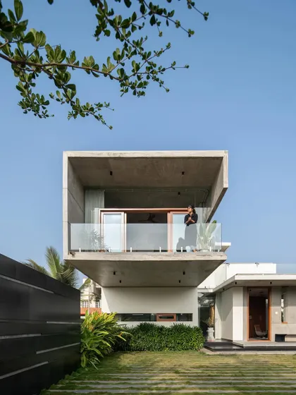 A person enjoying the view from the cantilevered balcony of The Quarry House, a private perch overlooking the landscape.