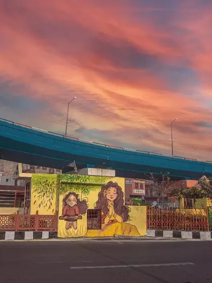 Finding beauty in urban landscapes. This shot from Agra captures vibrant local street art, combining it with a dramatic sunset to create a compelling urban photograph.