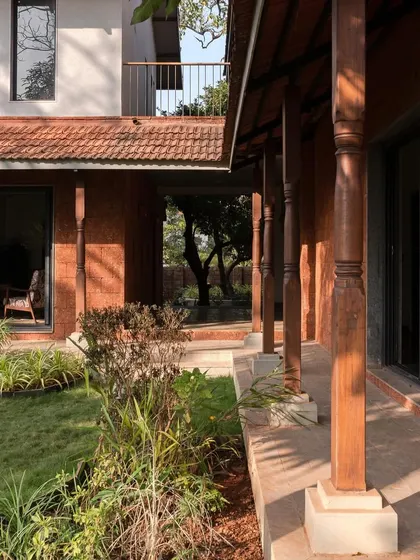 The veranda at Maison Rouge, with its row of reclaimed timber columns, creates a beautiful rhythm and a shaded space to relax.