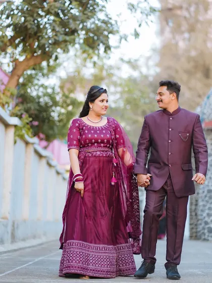 A happy, candid shot of the couple walking hand-in-hand after their Catholic wedding ceremony. Their smiles and easy stride show their joy and comfort with each other.