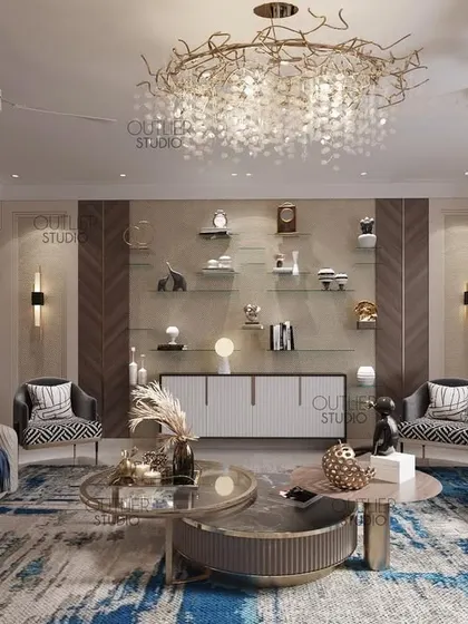 This living room uses a bold blue and white abstract rug as its centerpiece. The design is complemented by a stunning branch-like chandelier and a mix of neutral and patterned seating.