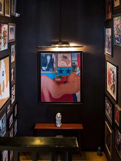 The hallway to my house is a gallery in itself, filled with art that is bold, colorful, and a little bit cheeky.
