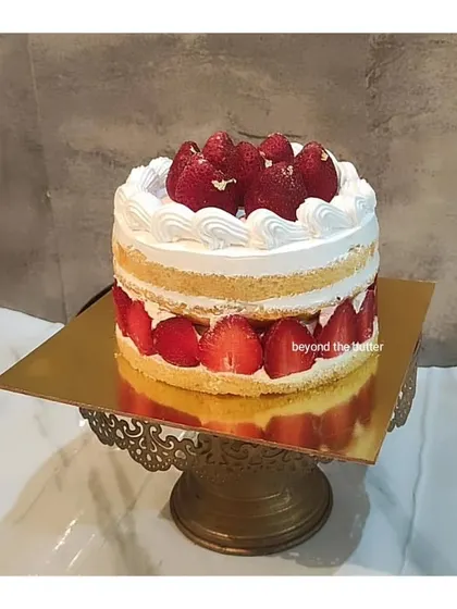My classic fresh strawberry cake, with layers of light sponge, whipped cream, and sliced strawberries.