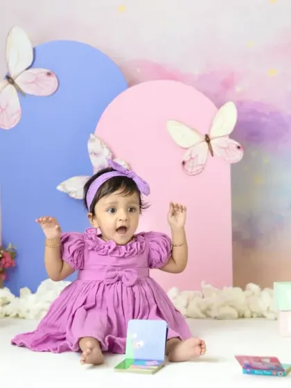 A magical unicorn and butterfly theme for a first birthday. The pastel colors, whimsical props, and dreamy backdrop create a true fairy tale setting.