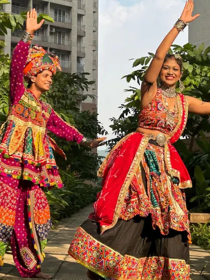 Ready to hit the dance floor together. This image showcases the full look for both him and her, from the pagdi to the flowing skirt.