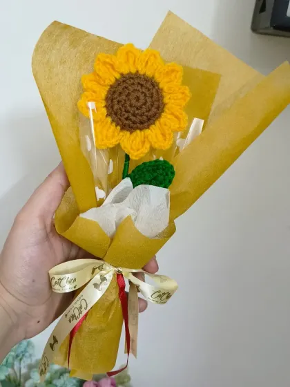 Another look at our beautifully wrapped single sunflower bouquet, tied with our custom CatChica ribbon.