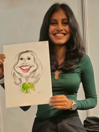 Her big smile shows how much she enjoyed getting her caricature done at the Redbull event.