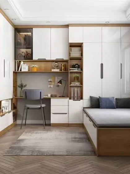 This design shows a fully integrated bedroom solution, with the wardrobe, study desk, and bed all part of a single custom unit.