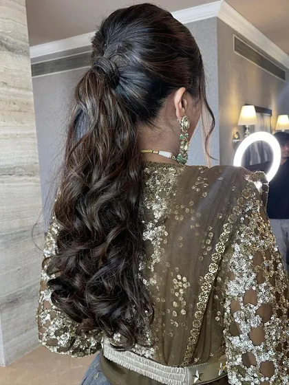 A back view of the ponytail, perfect for showing off a backless or detailed blouse.