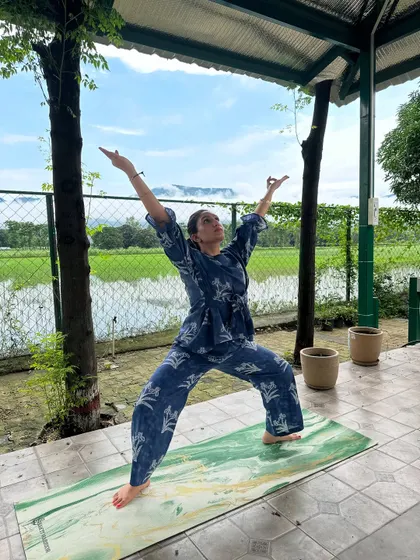 Opening the heart in Viparita Virabhadrasana, or Reverse Warrior pose. Practicing in nature helps us feel more connected and expansive.
