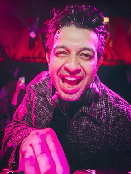 A candid shot capturing a moment of pure joy behind the decks at Seven Rivers. This is the happiness that music brings.