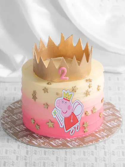 A royally fun Peppa Pig cake! This design features Princess Peppa and a golden crown, perfect for a little one's 2nd birthday.