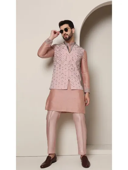 Another view of the 'Mystic Rose' set, showing the model adjusting his sunglasses. This pose adds a touch of personality and shows the outfit in a more dynamic, lifestyle context.