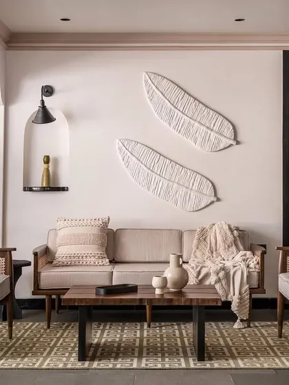 Inspired by tropical modernism, this living space is designed to feel like a getaway. We used natural materials like cane and wood for the custom armchairs and sofa, creating a relaxed yet refined atmosphere that celebrates tactile, organic design.