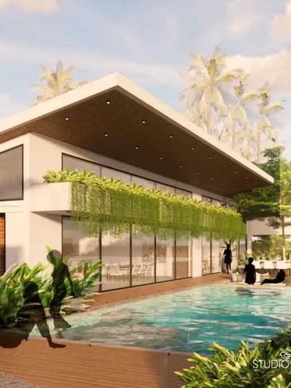 The party house and infinity pool area are designed for hosting and entertainment. The seamless transition from the indoor space to the pool deck, surrounded by lush greenery, creates a perfect setting for social gatherings.