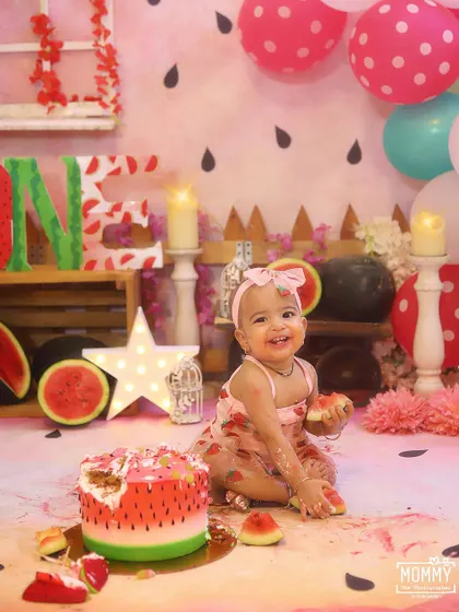 This happy smile says it all! A "One in a Melon" themed cake smash is such a fun and colourful way to celebrate a first birthday. I love capturing the pure joy as they dig into their very own watermelon cake.