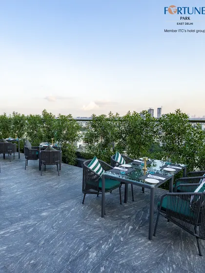The city skyline peeks through the greenery, offering a constant reminder of our unique urban oasis setting.