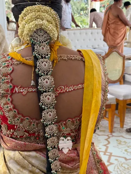 The personal touch of Bhavana's blouse, with the bride and groom's names embroidered on the back.