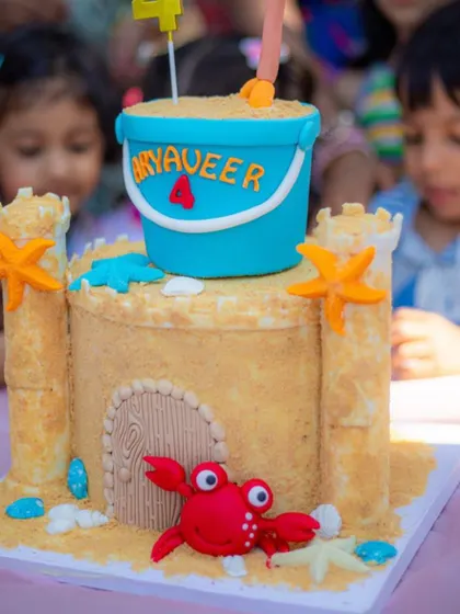 A client's photo of the sandcastle cake at the party.