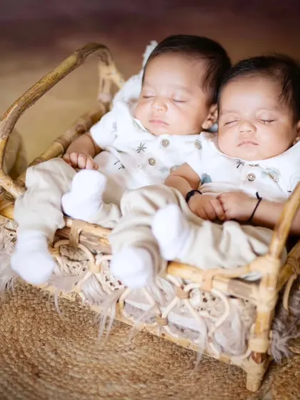 Two precious hearts sleeping side by side. This newborn twins photoshoot captures the special bond between siblings from their very first days.