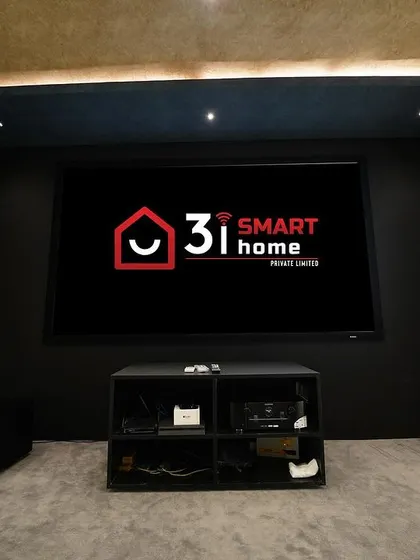 The central console of the Karur home cinema, showing the AV receiver, subwoofer, and other components neatly organized.