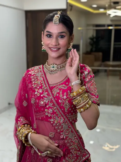 This bride's smile says it all. The makeup is subtle yet impactful, with a focus on glowing skin and beautifully defined eyes.
