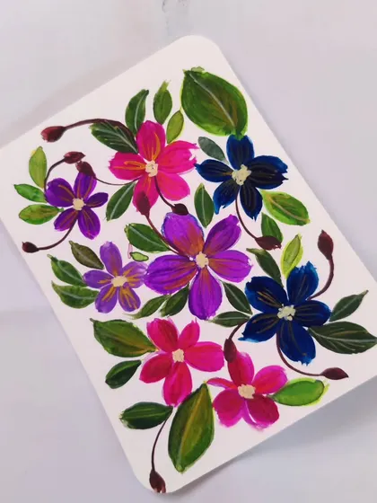 A colorful mix of purple, pink, and blue gouache flowers. I love playing with different color combinations to see what moods they create.