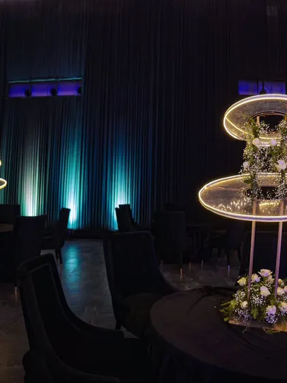 Modern illuminated centerpieces on cocktail tables, adding to the futuristic and stylish atmosphere of the Diwali party.