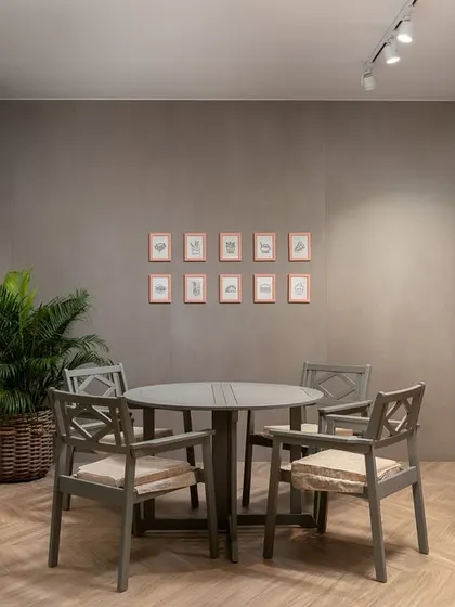 We designed this luxurious cafe concept within a tile showroom, featuring a dramatic rotating door clad in oversized, digitally printed tiles. This striking entrance sets the tone for an inviting haven that blends elegance with innovation.
