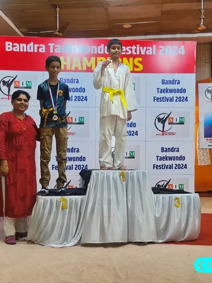 Raiyan takes the top spot on the podium, winning a gold medal at the Bandra Taekwondo Festival 2024. His focus and training paid off.