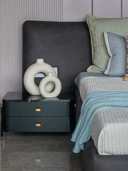 A little bit of calm in all the chaos. This bedroom uses a soft pastel color palette and a mix of textures to create a peaceful and relaxing environment.
