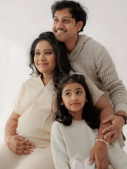 A happy family portrait celebrating their new beginning. I kept the makeup for the mom-to-be very natural and radiant to match the bright, airy feel of the studio photoshoot.