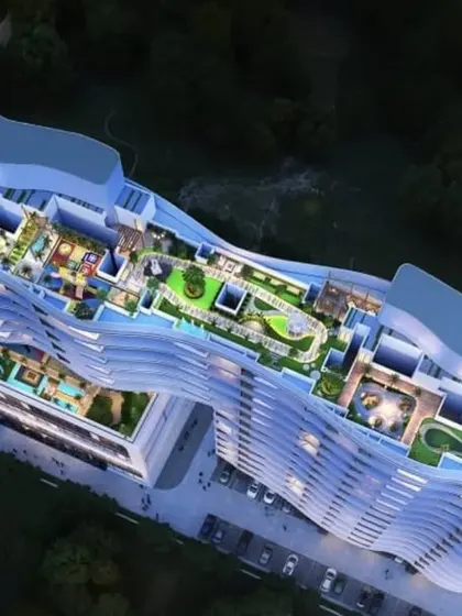 An aerial plan view of the Tropicano mixed-use project in Guwahati, showing the extensive rooftop amenities.