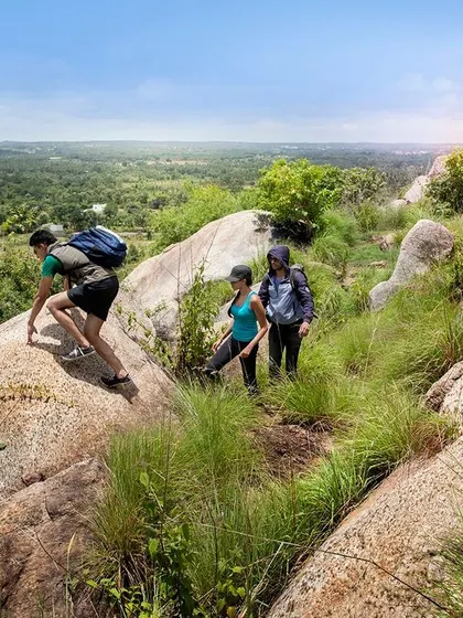 A group of hikers ascends a trail, showcasing the beautiful and rugged landscape that surrounds our resorts.