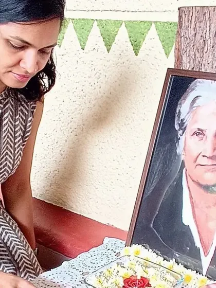 Our headmistress paying respect to a portrait of Dr. Maria Montessori.