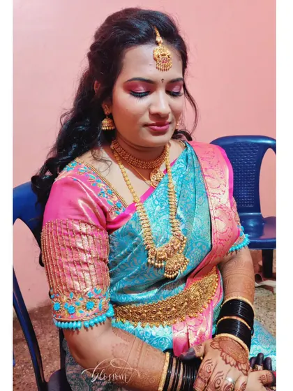 I loved creating this vibrant look for my cousin's special day. The bright pink eyeshadow adds a fun pop of colour that complements her turquoise and pink saree beautifully.