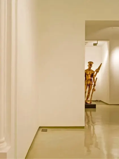 A view through a series of arched openings in the Sakshi Art Gallery. The design leverages the existing layout of the heritage building to create layered views and a sense of discovery as one moves through the space.