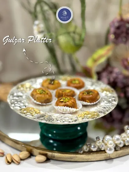 A close-up of the Gulzar Platter, featuring an intricate floral border. It's the perfect size for serving 'mithai' or other small delicacies with grace.