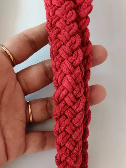 The vibrant red cotton cord used for this lanyard is soft and durable.