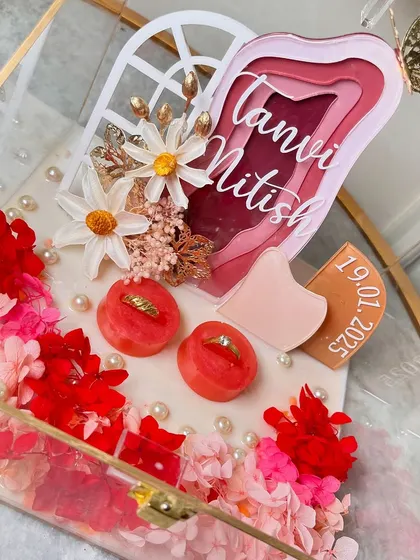 A different angle of the layered ring platter, showing the depth and detail of the custom name sign and floral arrangement.