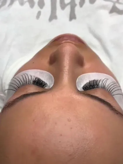 This is what your lashes look like during the application. The eye pads protect your lower lashes and skin while I work my magic on the top.