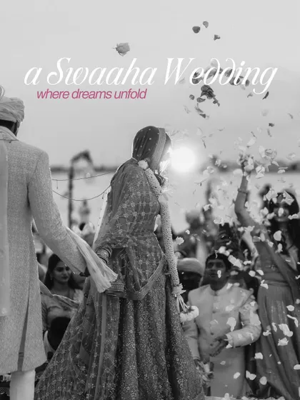 A timeless black and white photo of the bride's processional, with flower petals showering down, capturing a moment of pure magic.