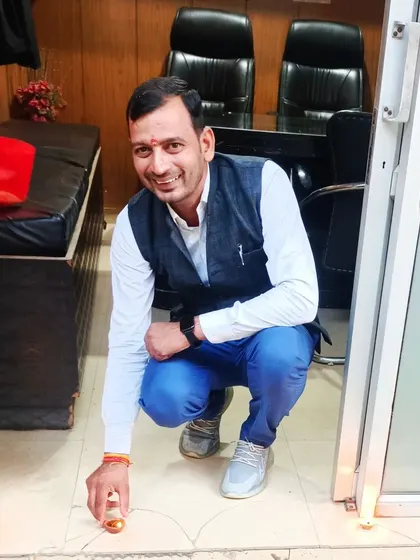 Lighting diyas at the entrance of my office for Diwali. May the light of justice always shine bright.