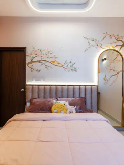 Here, the cherry blossom theme continues onto the wardrobe doors, integrating storage seamlessly into the room's artistic narrative. The hand-painted details ensure that even functional elements contribute to the overall beauty of the design.
